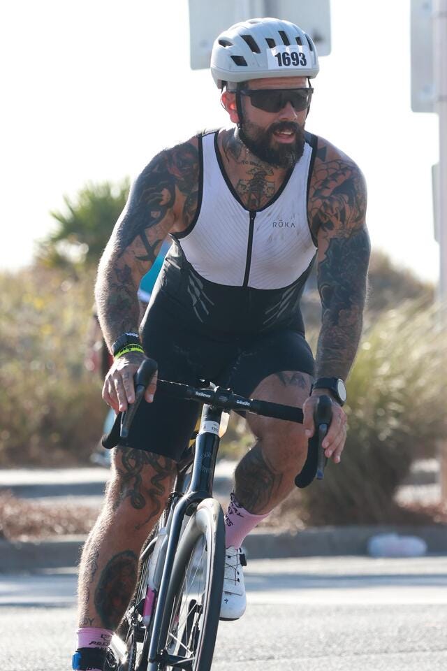 athlete riding a bicycle during a triathlon event