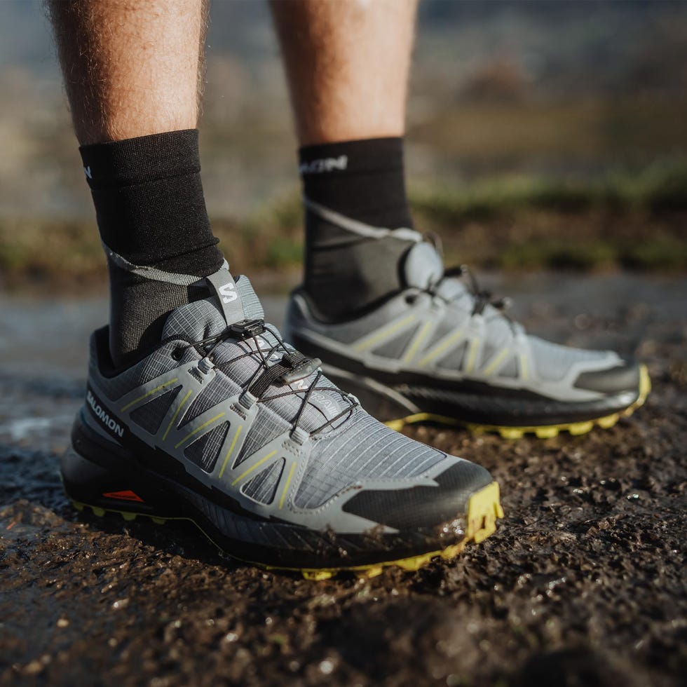 las salomon speedcroos peak running shoes worn with black socks in a natural outdoor setting