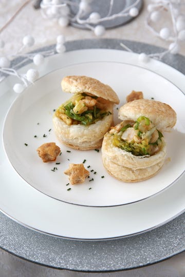 savory puff pastries filled with shrimp and vegetables served on a white plate