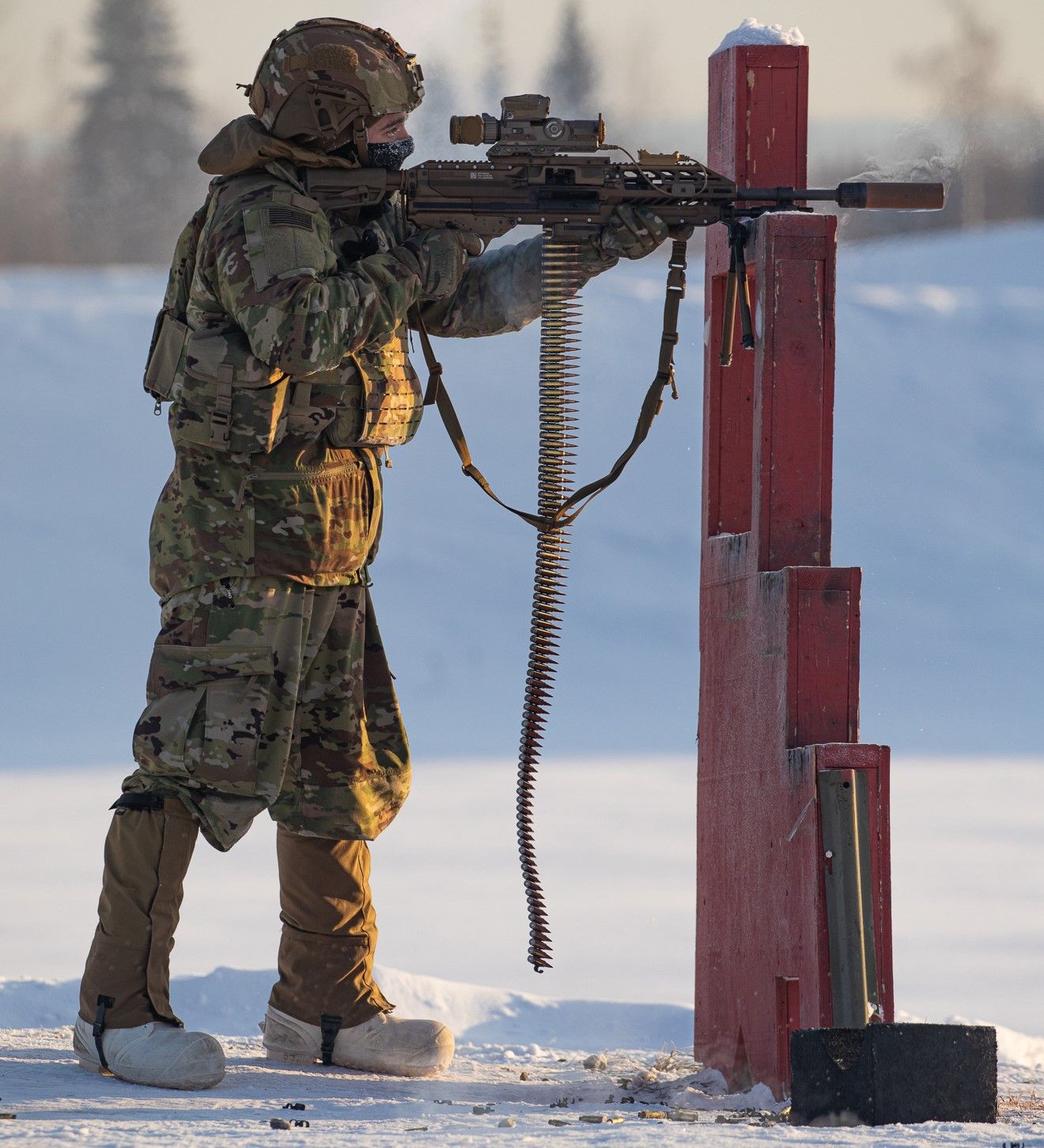 A soldier who fires a gun using a machine