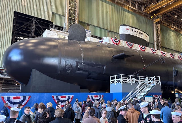 240316 n gr655 1267 groton, conn march 16, 2024 – spectators gather to observe a christening of the pre commissioning unit pcu idaho ssn 799 during a ceremony at general dynamics electric boat shipyard facility in groton, conn, march 16, 2024 the future uss idaho and crew operate under submarine squadron subron four whose primary mission is to provide attack submarines that are ready, willing, and able to meet the unique challenges of undersea combat and deployed operations in unforgiving environments across the globe us navy photo by chief petty officer joshua karsten