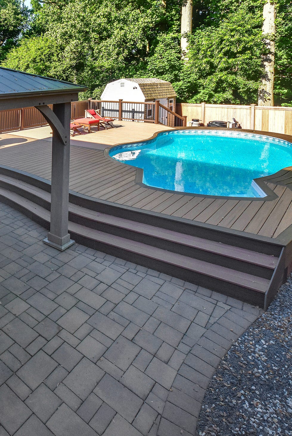a swimming pool with a covered patio a swimming pool with a covered patio