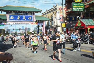 a man running a marathon wearing red high heels for domestic violence awareness