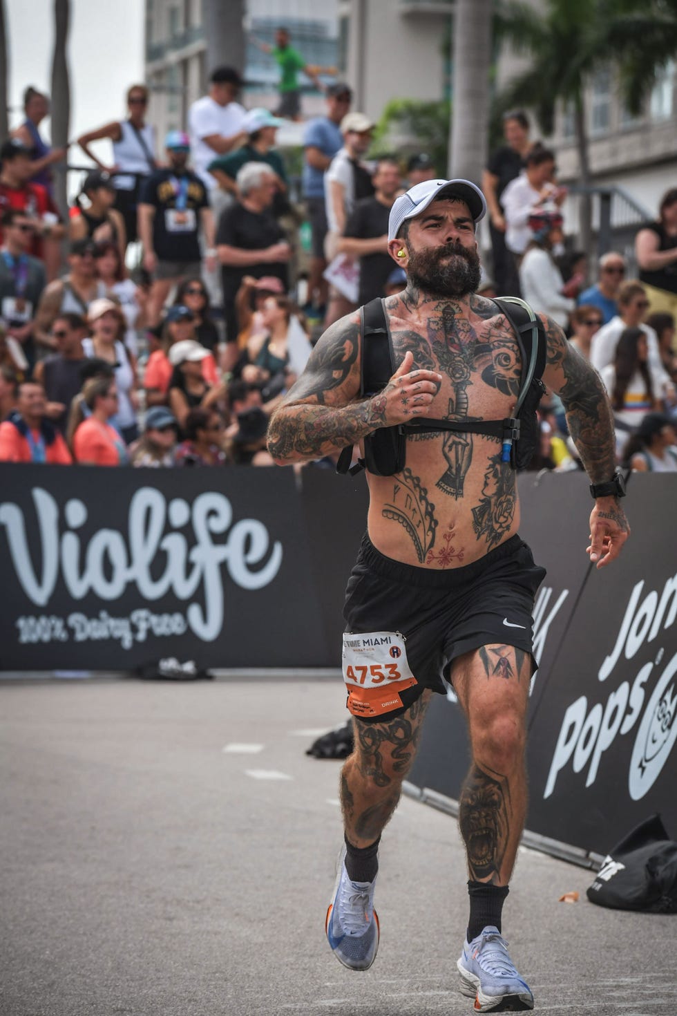 runner participating in an event with spectators in the background