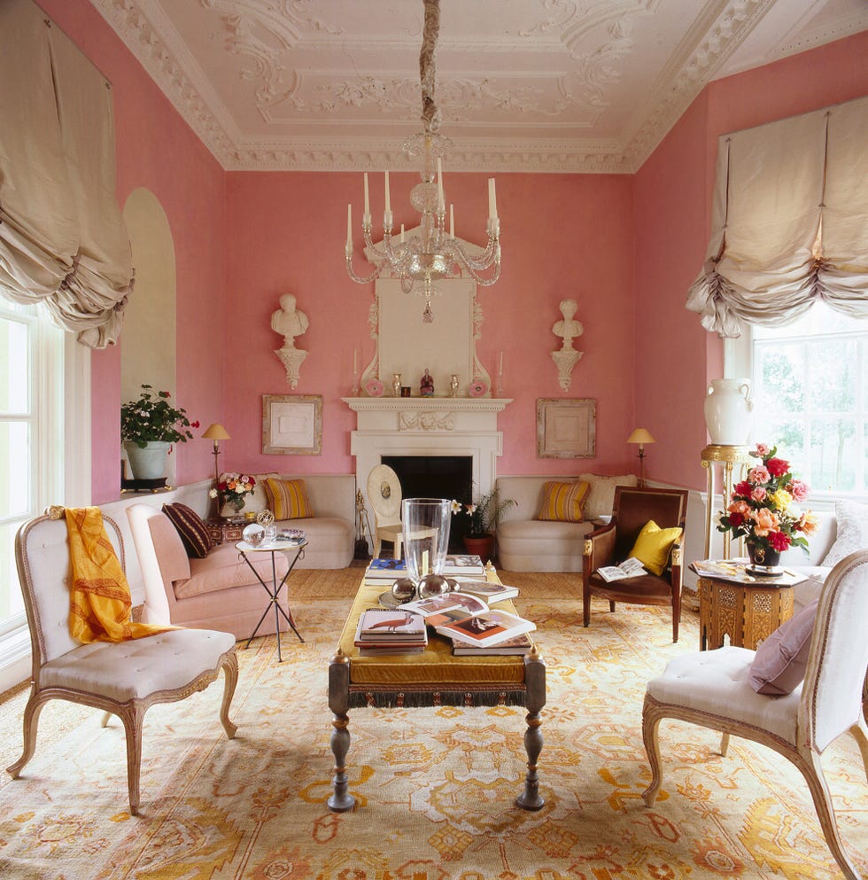 Elegant living room with a pink theme and classic furnishings.