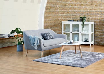 Furniture, Floor, Room, Living room, Wall, Interior design, Wood flooring, Couch, Table, Laminate flooring, 