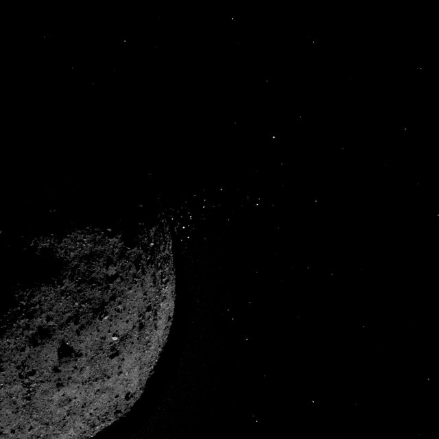 The asteroid Bennu ejects material into space.