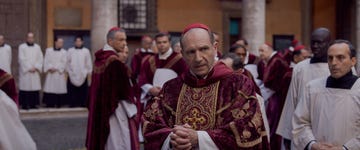 Clergy gathered in ceremonial attire during a religious event.