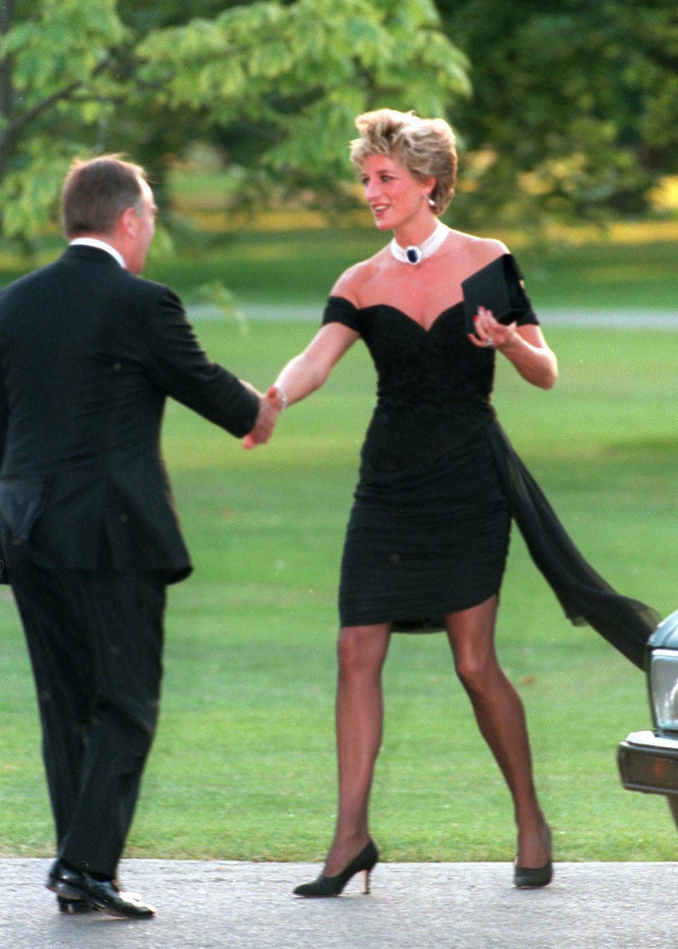 Diana, Princess of Wales, wearing a stunning black dress commissioned from Christina Stambolian, attends the Vanity Fair party