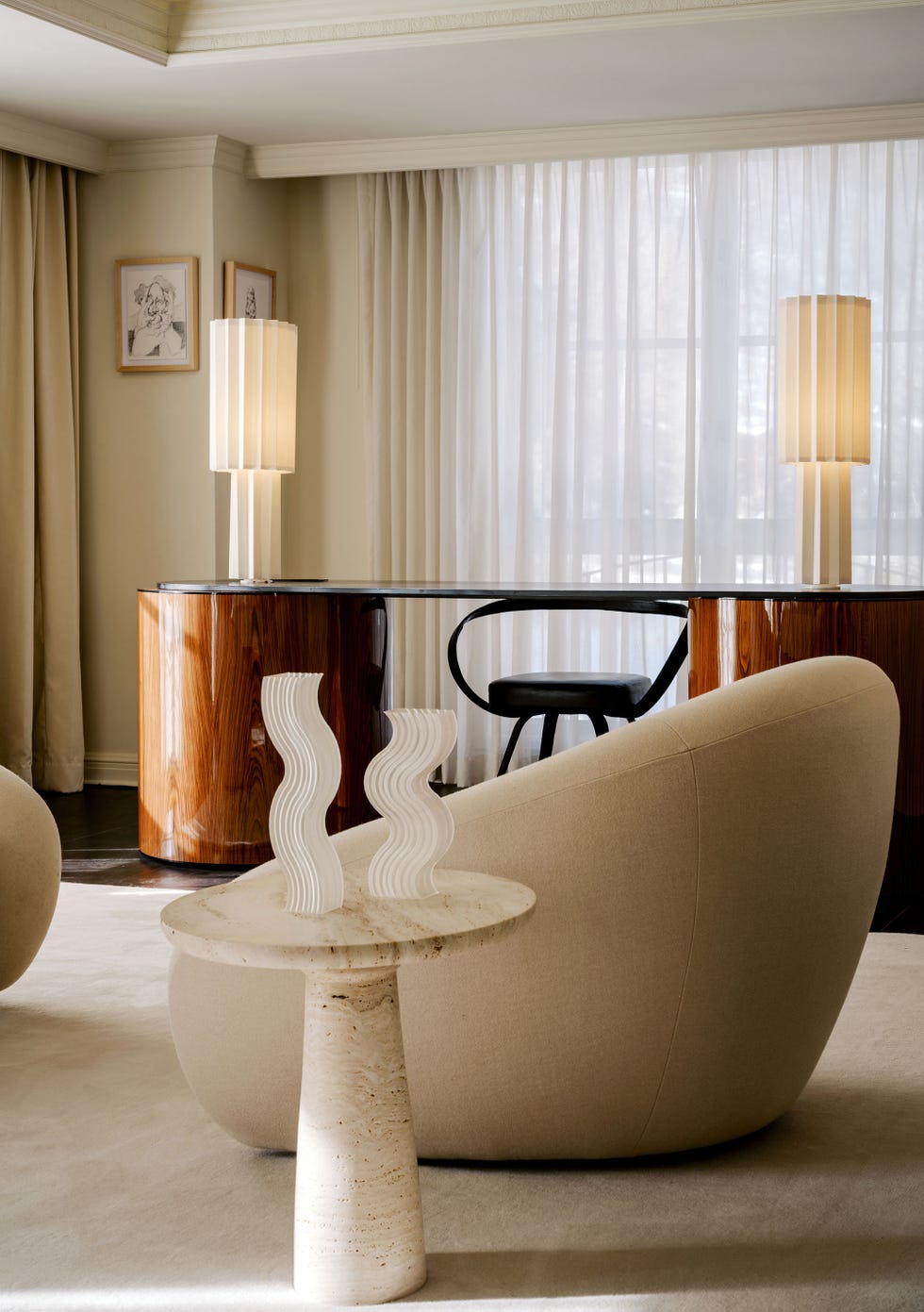Modern interior design featuring a lounge area and desk.