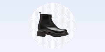 Black ankle boot with a modern design.