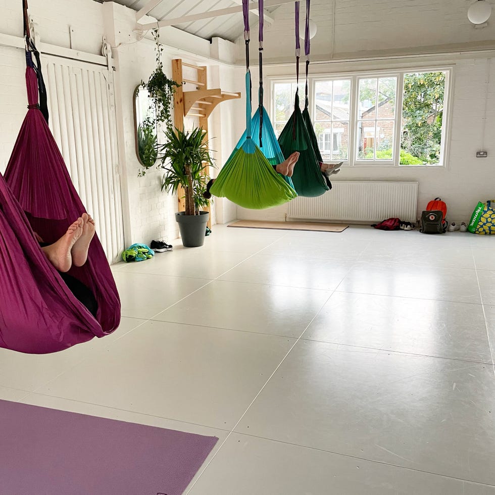 women doing aerial yoga