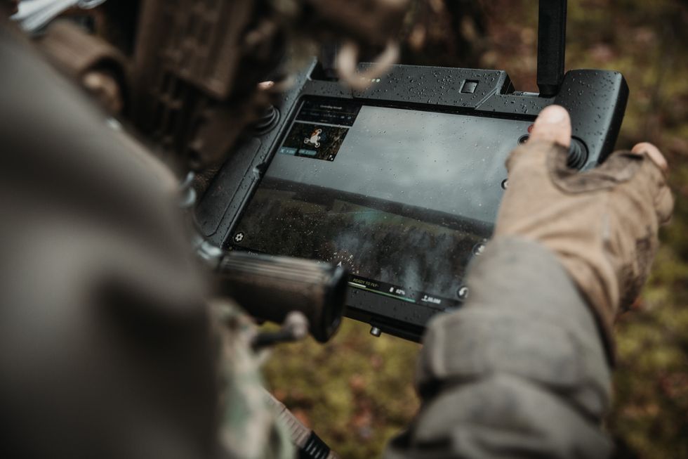 soldier looking at atlaspro drone screen