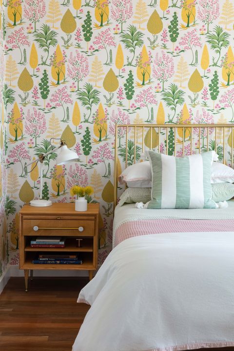 bedroom, striped cushions, wooden cabinets, colorful wallpaper