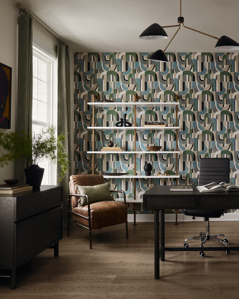 modern office space featuring a patterned wallpaper and stylish furniture