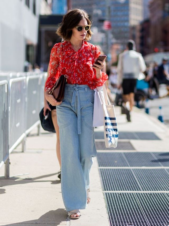 new york, ny   september 11 a guest with high waisted wide leg denim jeans outside j crew on september 11, 2016 in new york city photo by christian vieriggetty images
