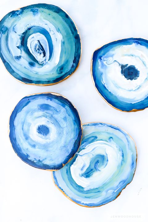 handmade coasters made to look thin slices of polished blue stone with gilt edges