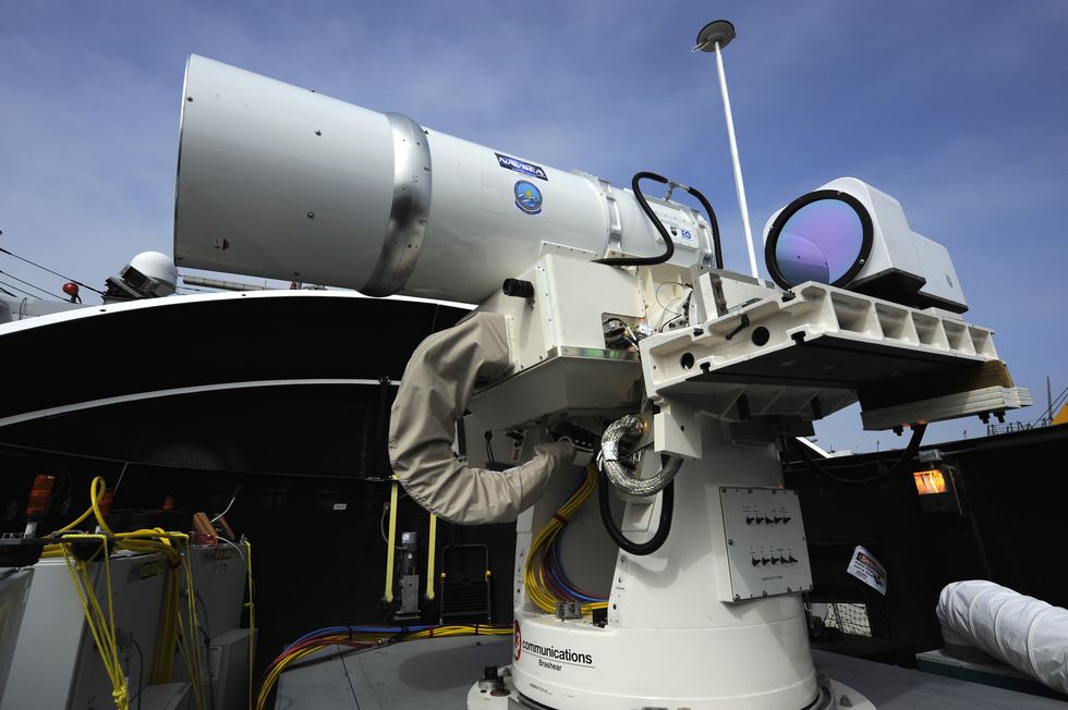 120730 n po203 310san diego july 30, 2012 the laser weapon system laws temporarily installed aboard the guided missile destroyer uss dewey ddg 105 in san diego, calif, is a technology demonstrator built by the naval sea systems command from commercial fiber solid state lasers, utilizing combination methods developed at the naval research laboratory laws can be directed onto targets from the radar track obtained from a mk 15 phalanx close in weapon system or other targeting source the office of naval research's solid state laser ssl portfolio includes laws development and upgrades providing a quick reaction capability for the fleet with an affordable ssl weapon prototype this capability provides navy ships a method for sailors to easily defeat small boat threats and aerial targets without using bullets us navy photo by john f williamsreleased