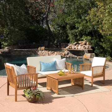 Amazon Spring Sale Patio Furniture Sale outdoor seating area with a wooden table and chairs beside a pool