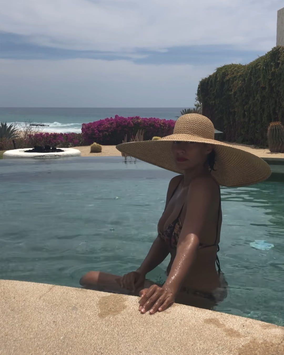 Tracee Ellis Ross Sunbathing in a Bikini and Massive Straw Hat Is the Best Thing You'll See Today