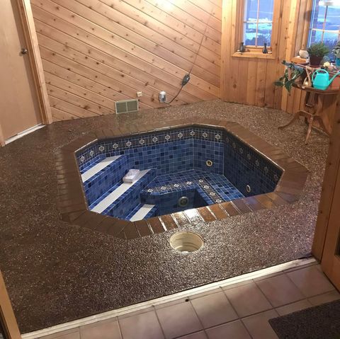 indoor hot tub with blue tiles
