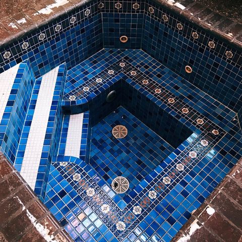 blue tiled indoor hot tub