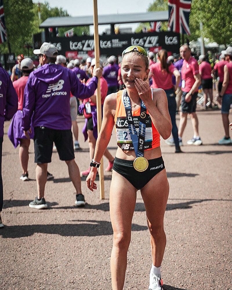 runner celebrating after completing a marathon