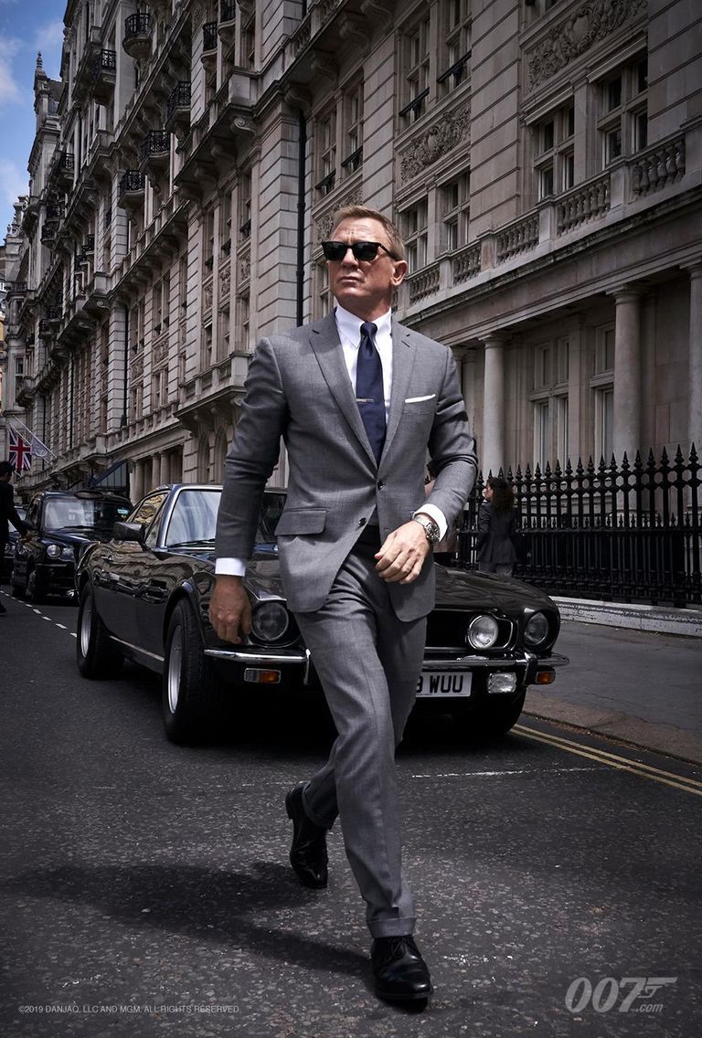 Suit, Vehicle, Luxury vehicle, Car, Street fashion, Automotive design, Outerwear, Formal wear, White-collar worker, Photography, 