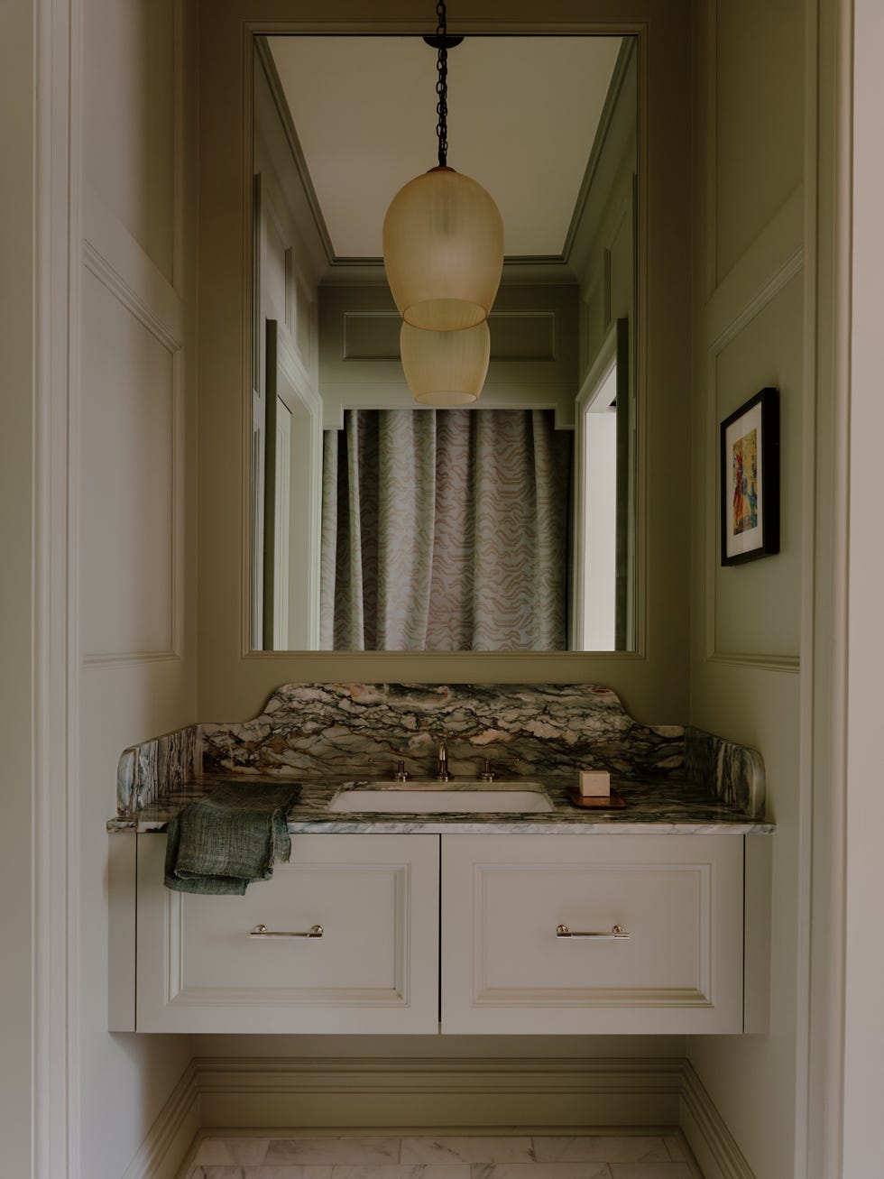 Small elegant bathroom with a sink and decorative elements. Small elegant bathroom with a sink and decorative elements.
