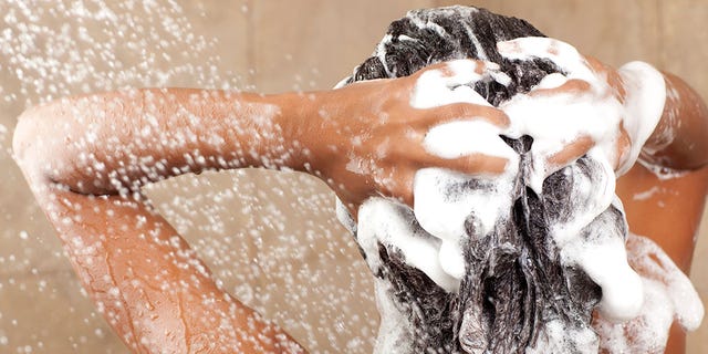 woman shampooing hair