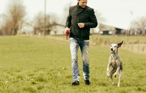 man walking with dog to ease anxiety