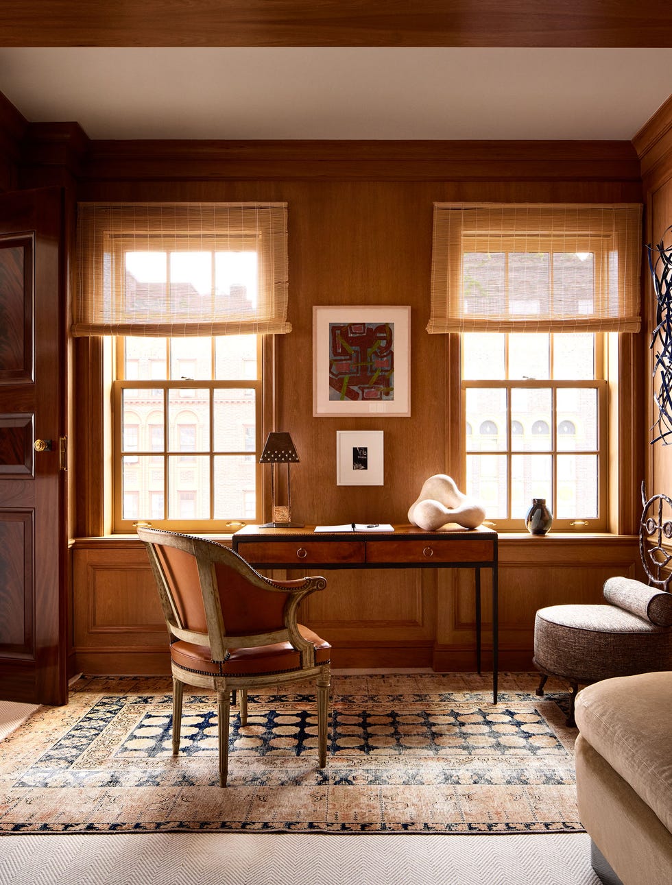 Home office setup featuring a desk, chair, and decorative elements.