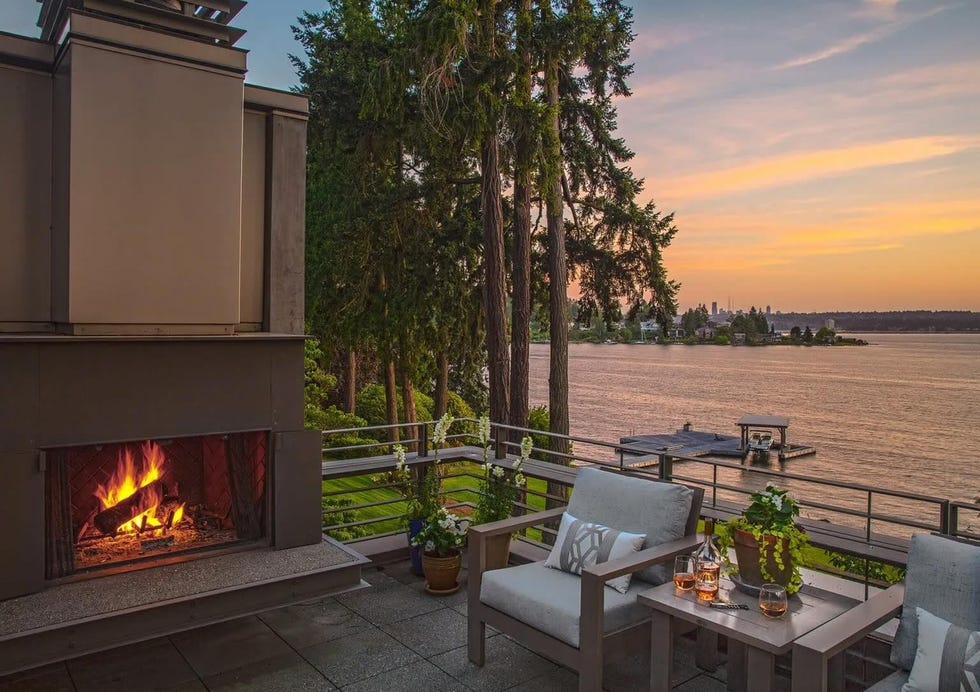 the rooftop terrace features a fireplace and ideal views of lake washington.