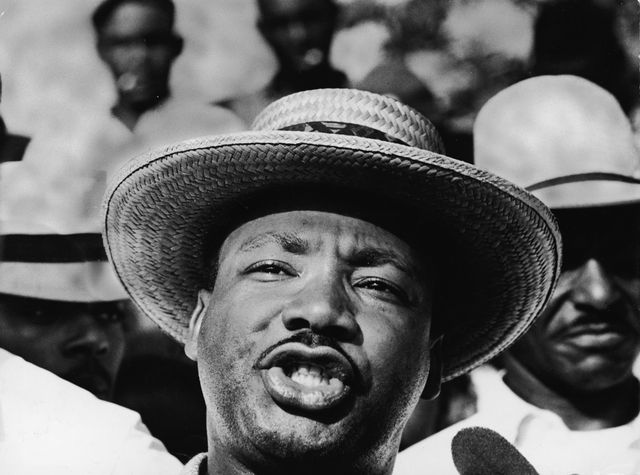 Dr. Martin Luther King Jr. speaks to reporters during a march en route to Jackson, Mississippi,
