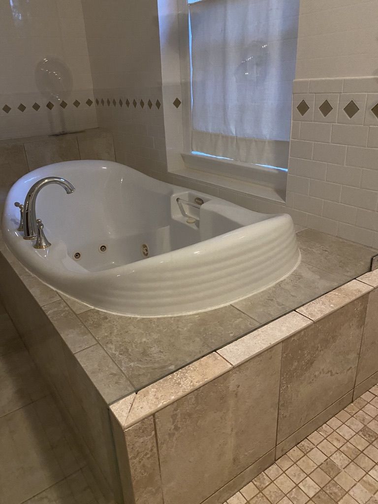 WE TOOK OUT THE JACUZZI TUB TO MAKE LARGE SHOWER --- THE RESULTS