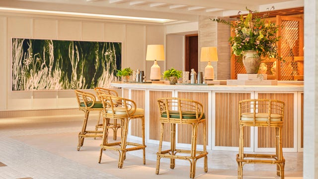 A bar with high top chairs