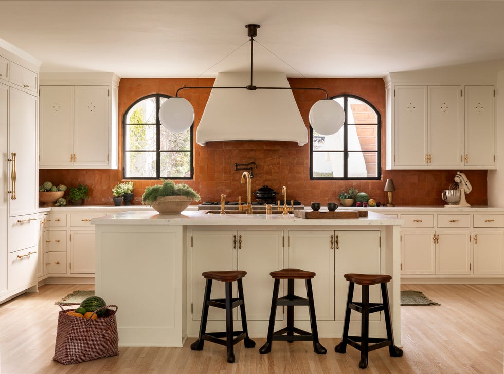 Modern kitchen with a large island and seating.