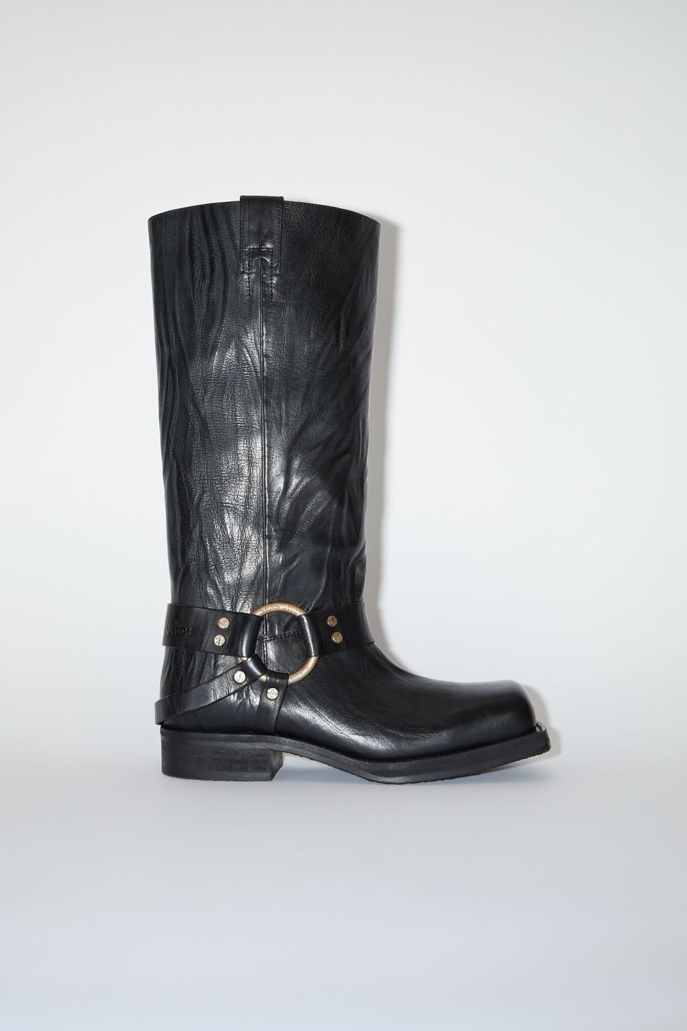 a black boot with a silver buckle