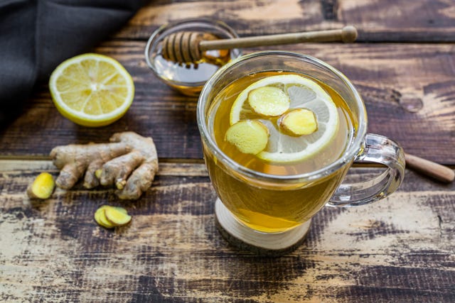 a cup of lemon ginger tea with honey