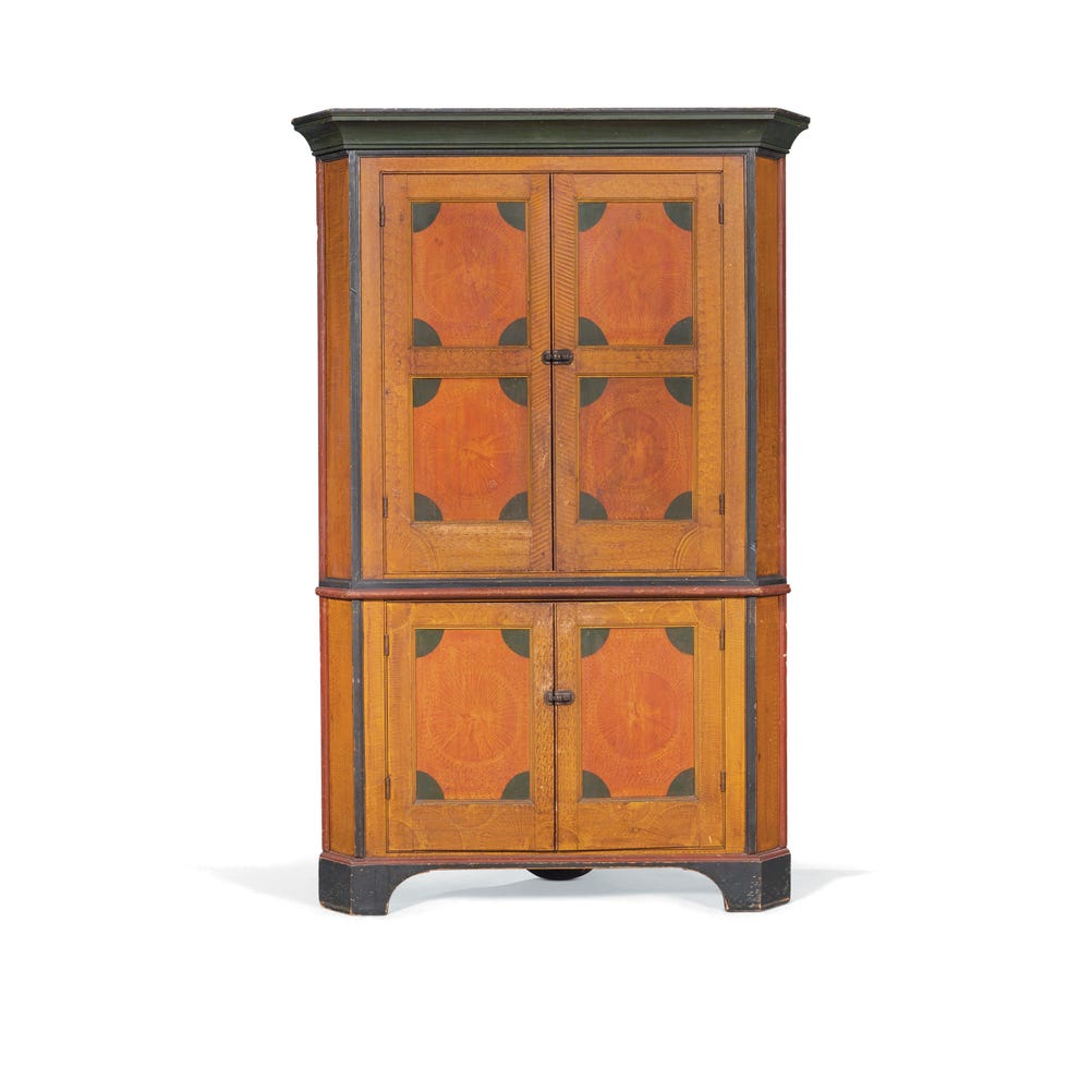 wooden cabinet with decorative paneling and two sets of doors