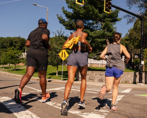group of runners crossing a street