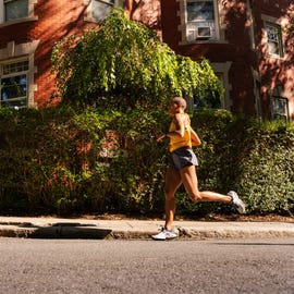 RWX a runner passing a wall covered in ivy