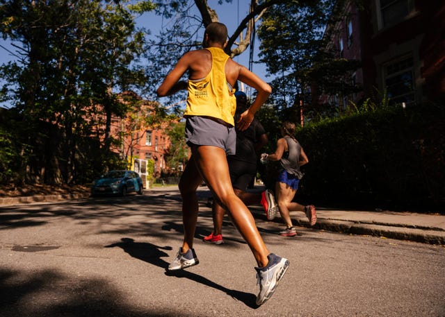 person running with friends on street