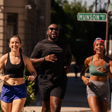 three runners smiling