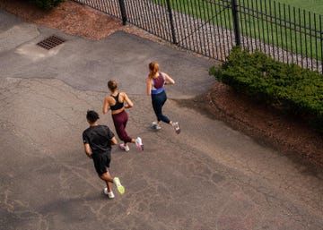 runners logging miles on pavement
