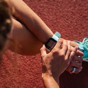 woman checking smartwatch after running