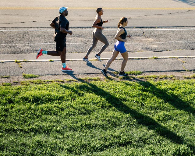 three people running hard