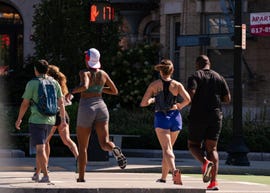 group of runners jogging on the street
