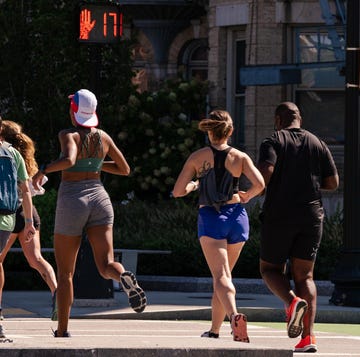 group of runners jogging on the street group of runners jogging on the street