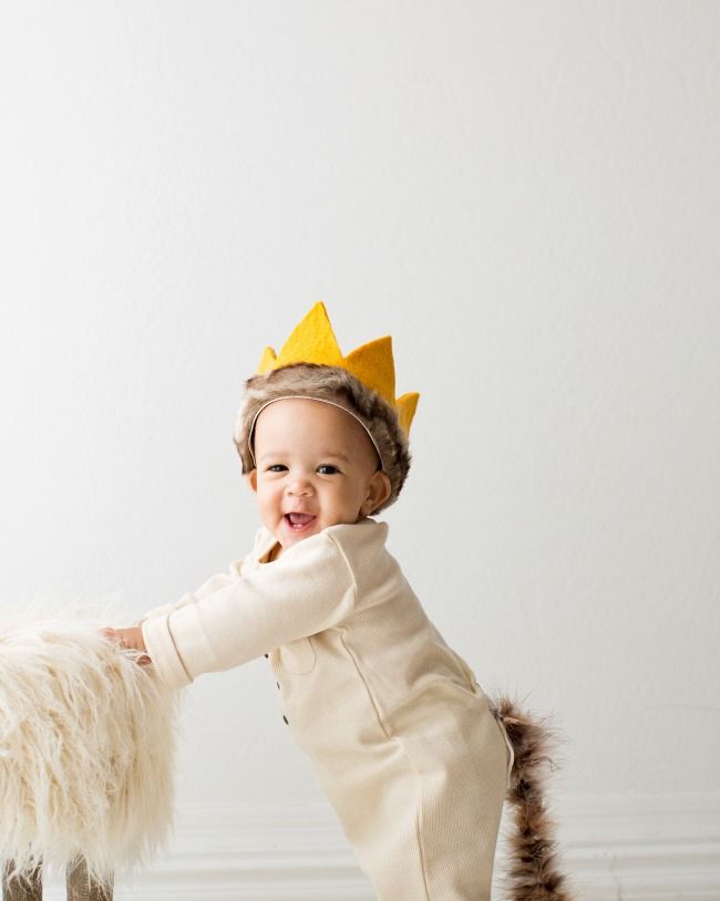 toddler dressed as max from where the wild things are with furry tail and yellow crown